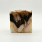Marbled soap bar with brown and beige colors on a white background